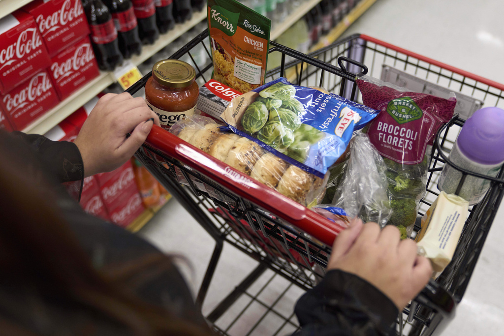 FILE - Jaqueline Benitez, who depends on California's SNAP benefits to help pay for food, shops for groceries at a supermarket in Bellflower, Calif., Feb. 13, 2023. (AP Photo/Allison Dinner, File)