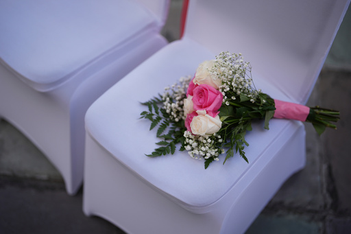 FILE - A bouquet of flowers rests on a chair ahead of a Valentine's Day group wedding ceremony at the Dade County Courthouse in Miami, Friday, Feb. 14, 2025. (AP Photo/Rebecca Blackwell, File) FILE - A bouquet of flowers rests on a chair ahead of a Valentine's Day group wedding ceremony at the Dade County Courthouse in Miami, Friday, Feb. 14, 2025. (AP Photo/Rebecca Blackwell, File)