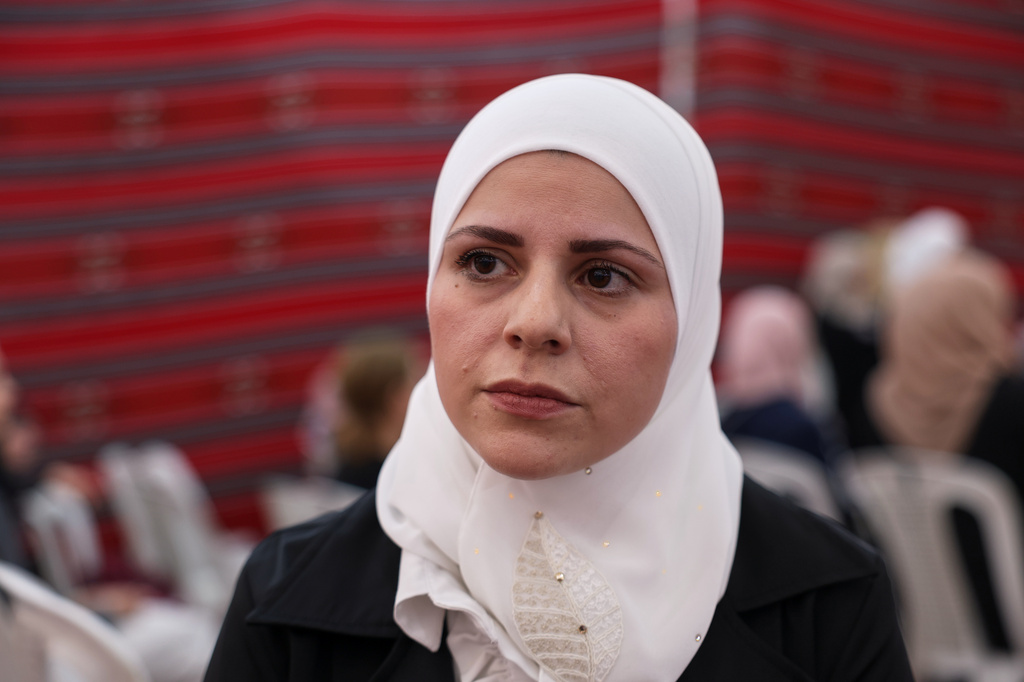 Doa'a al-Abbasi, cousin of former chess champion Rania al-Abbasi, attends a gathering to mourn al-Abbasi and her family, who disappeared 13 years ago, after relatives announced Monday they had evidence the family was killed by pro-government gunmen in 2013, in Damascus, Syria, Tuesday, June 2, 2026. (AP Photo/Ghaith Alsayed)