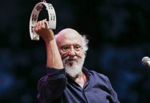 Greek singer-songwriter Dionysis Savvopoulos, performs at the Athens Concert Hall on Sept. 1, 2020. (InTime News via AP) Greek singer-songwriter Dionysis Savvopoulos, performs at the Athens Concert Hall on Sept. 1, 2020. (InTime News via AP)