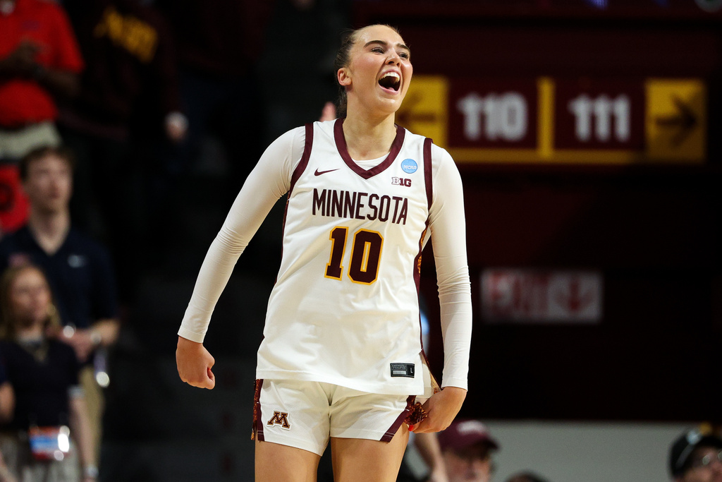 Minnesota guard Mara Braun celebrates her 3-point basket against Mississippi during the first half in the second round of the NCAA college basketball tournament, Sunday, March 22, 2026, in Minneapolis. (AP Photo/Matt Krohn)