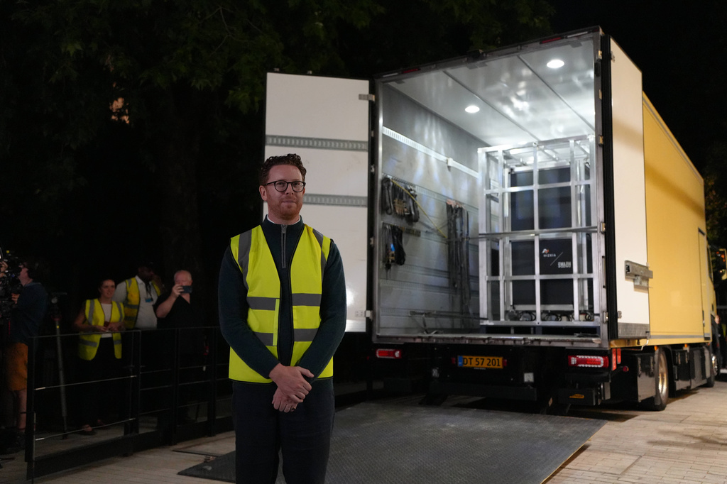 British Museum Director Nicholas Cullinan stands in front of a truck that carried the Bayeux Tapestry from France at the British Museum in London, Friday, July 10, 2026. (AP Photo/Kwiyeon Ha)