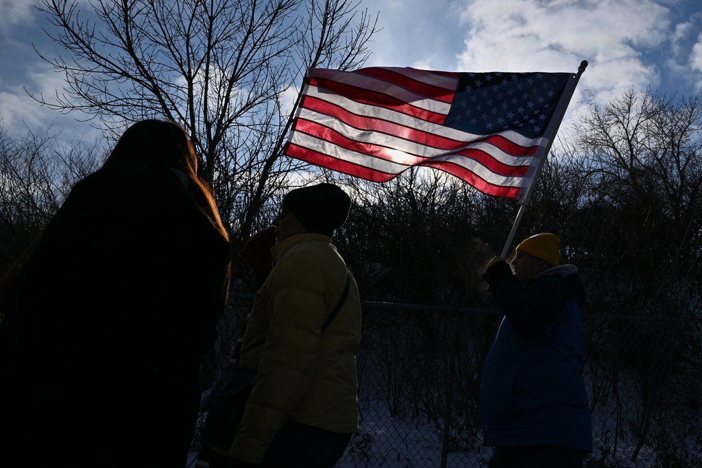 Protesters gather at a rally for immigrant and worker outside Signature Aviation near the Minneapolis–Saint Paul International Airport, Wednesday, Dec 3, 2025, in Minneapolis. (AP Photo/Tom Baker)