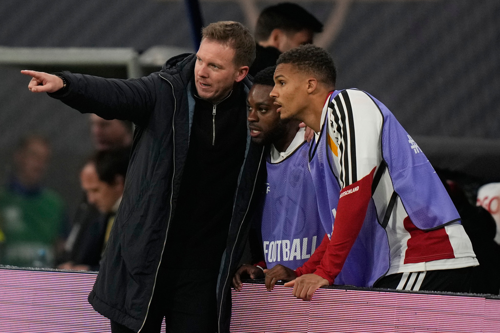 FILE - Germany's coach Julian Nagelsmann talks to reserve players during a group A World Cup qualifiying soccer match between Germany and Slovakia in Leipzig, Germany, Monday, Nov. 17, 2025. (AP Photo/Matthias Schrader, File)