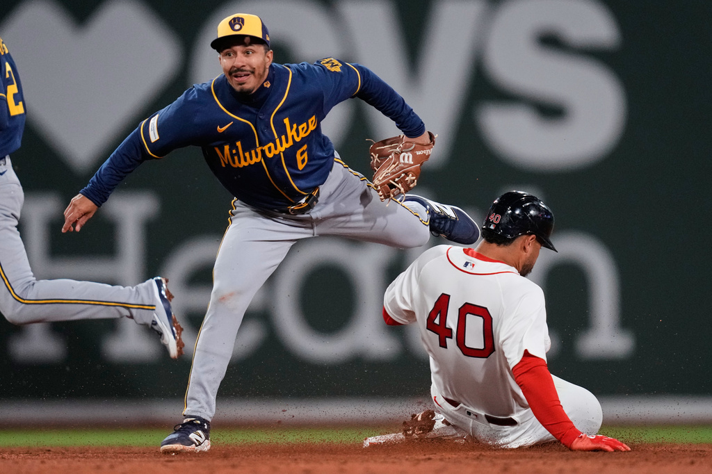 Boston Red Sox's Willson Contreras (40) is forced out by Milwaukee Brewers shortstop David Hamilton (6) during the third inning of a baseball game at Fenway Park, Monday, April 6, 2026, in Boston. (AP Photo/Charles Krupa)