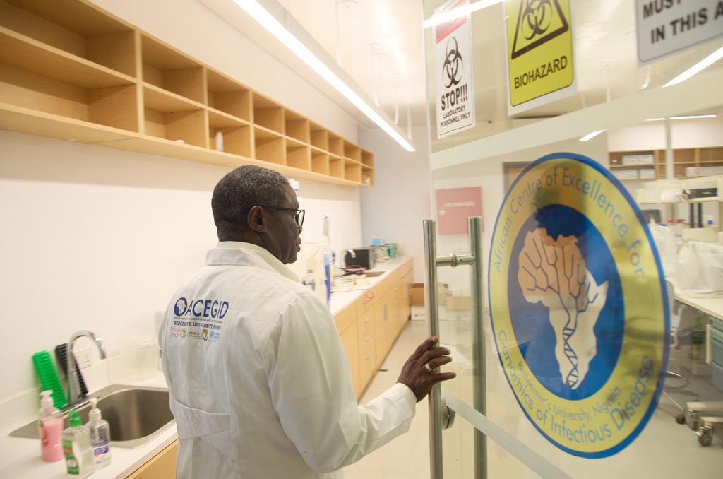Dr. Christian Happi enters the laboratory at the Institute of Genomics and Global Health, in Ede Southwestern, Nigeria, Nov. 17, 2025. (AP Photo/Ajayi Oluwapelumi)