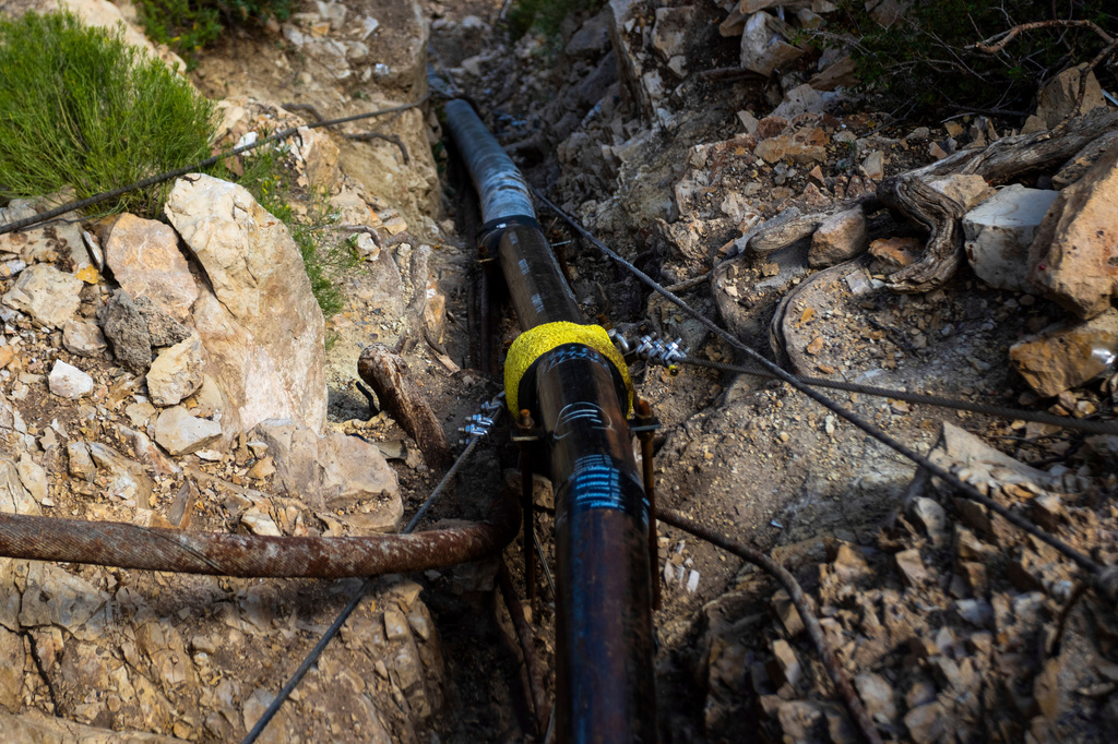 FILE - A section of pipeline that brings water to the South Rim of Grand Canyon National Park is seen below Bright Angel Lodge in Arizona, Aug. 30, 2024. (AP Photo/Ty ONeil, File)