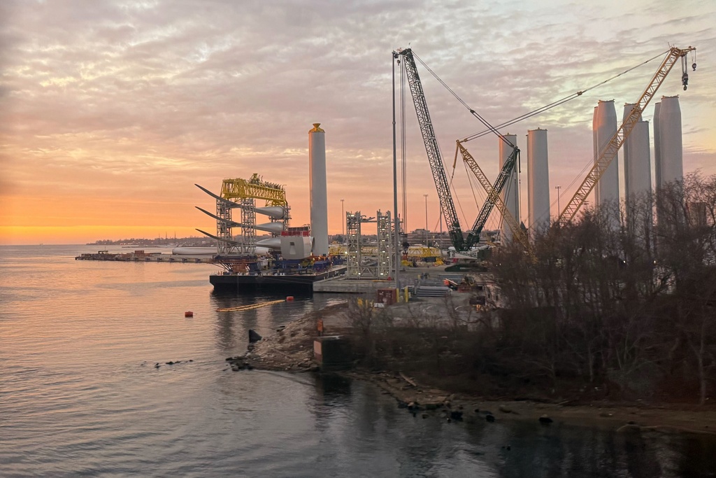 Blades and turbine bases for offshore wind sit at a staging area at New London State Pier, Wednesday, Jan. 14, 2026, in New London, Conn. (AP Photo/Matt O'Brien)
