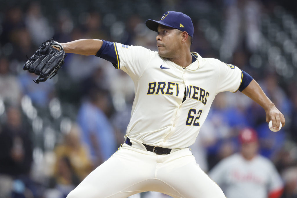Milwaukee Brewers' Jose Quintana (62) throws to the Philadelphia Phillies during the first inning of a baseball game Wednesday, Sept. 3, 2025, in Milwaukee. (AP Photo/Jeffrey Phelps)