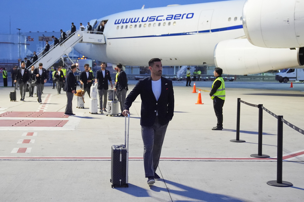 Iran's Ehsan Hajisafi arrives with his teammates for the World Cup soccer tournament in Tijuana, Mexico, Sunday, June 7, 2026. (AP Photo/Gregory Bull)