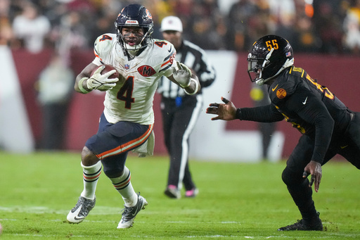 Chicago Bears running back D'Andre Swift (4) gets away from Washington Commanders defensive end Jacob Martin (55) during the second half of an NFL football game Monday, Oct. 13, 2025, in Landover, Md. (AP Photo/Stephanie Scarbrough) Chicago Bears running back D'Andre Swift (4) gets away from Washington Commanders defensive end Jacob Martin (55) during the second half of an NFL football game Monday, Oct. 13, 2025, in Landover, Md. (AP Photo/Stephanie Scarbrough)
