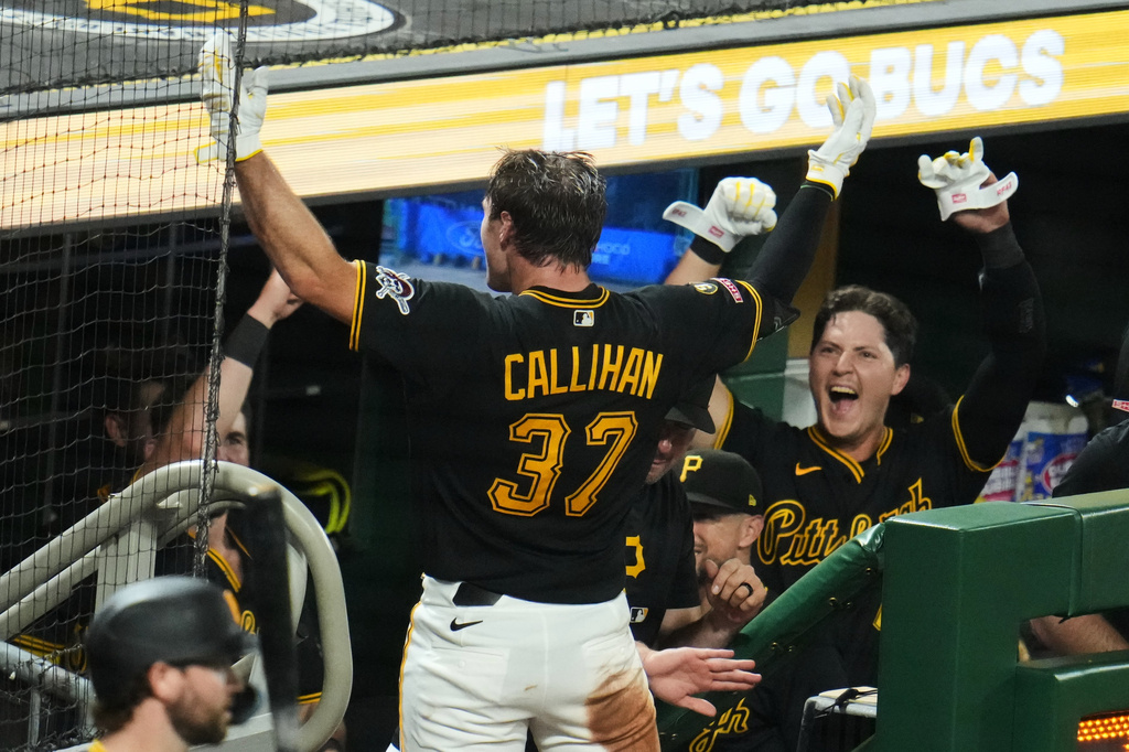 Pittsburgh Pirates' Tyler Callihan (37) takes a curtain call on the dugout steps after hitting a three-run home run off Los Angeles Dodgers pitcher Kyle Hurt during the eighth inning of a baseball game in Pittsburgh, Wednesday, June 10, 2026. (AP Photo/Gene J. Puskar)