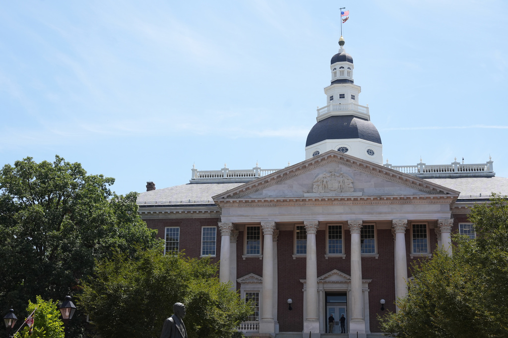 People stand at the doors of the Maryland State House on Tuesday, Aug. 4, 2026, in Annapolis, Md. (AP Photo/Mingson Lau)