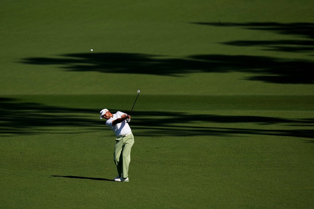 Jason Day, of Australia, hits from the fairway on the second hole during the first round of the Masters golf tournament at the Augusta National Golf Club, Thursday, April 9, 2026, in Augusta, Ga. (AP Photo/David J. Phillip)