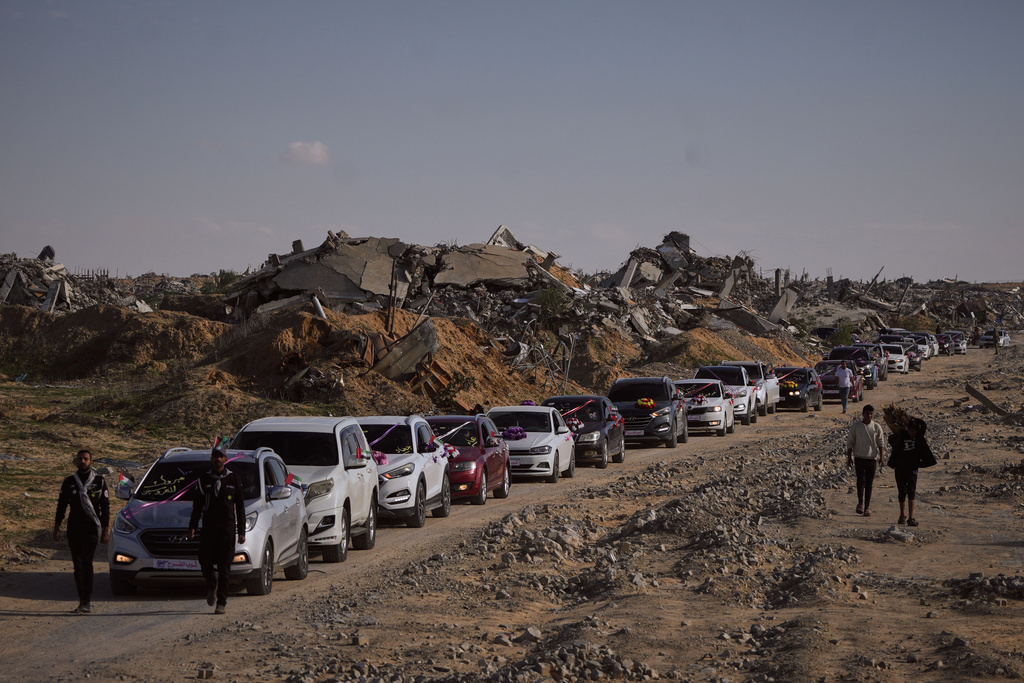 A convoy of Palestinian grooms travels to Hamad City in Khan Yunis, in the Gaza Strip, to take part in a mass wedding ceremony Tuesday, Dec. 2, 2025. (AP Photo/Abdel Kareem Hana)