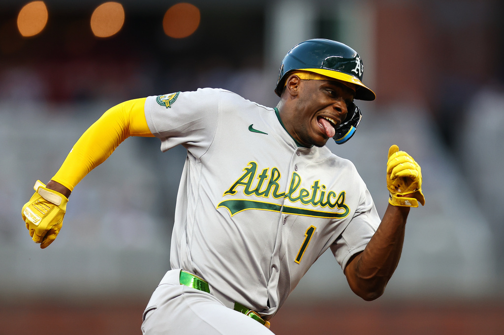 Athletics' Denzel Clarke (1) rounds third base before scoring a run in the second inning of a baseball game against the Atlanta Braves, Tuesday, March 31, 2026, in Atlanta. (AP Photo/Colin Hubbard)