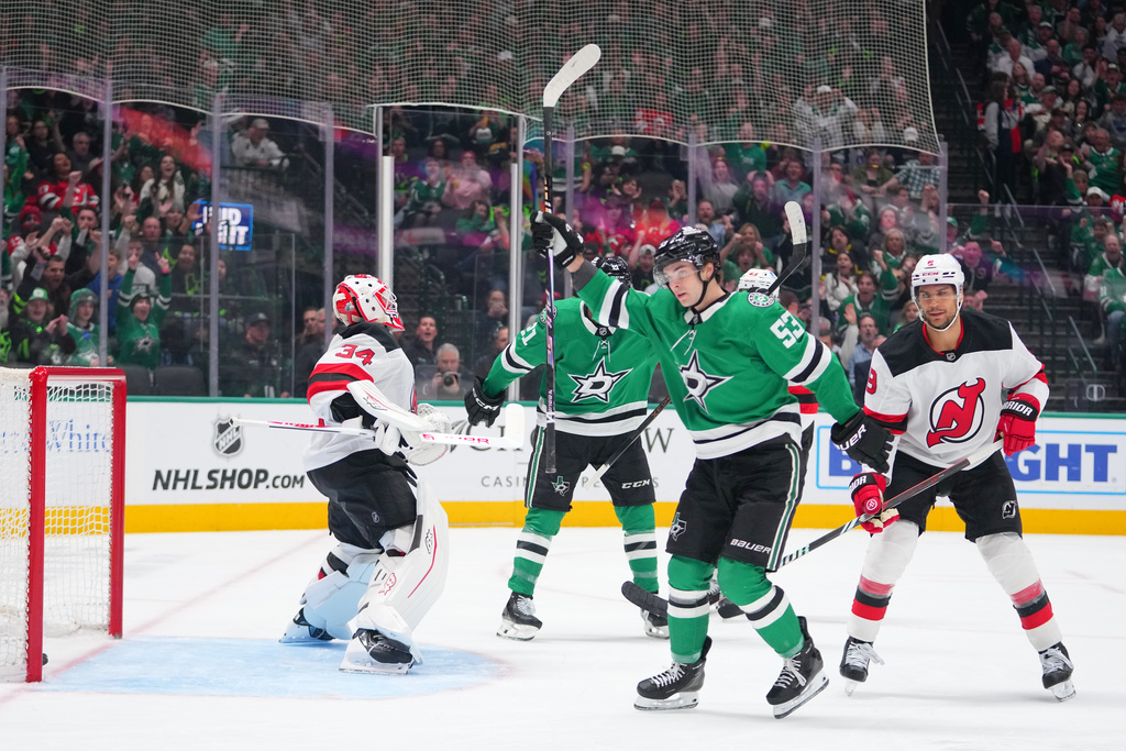 Dallas Stars center Wyatt Johnston (53) reacts after scoring a goal on New Jersey Devils goaltender Jake Allen (34) during the first period of an NHL hockey game Tuesday, March 24, 2026, in Dallas. (AP Photo/Julio Cortez)