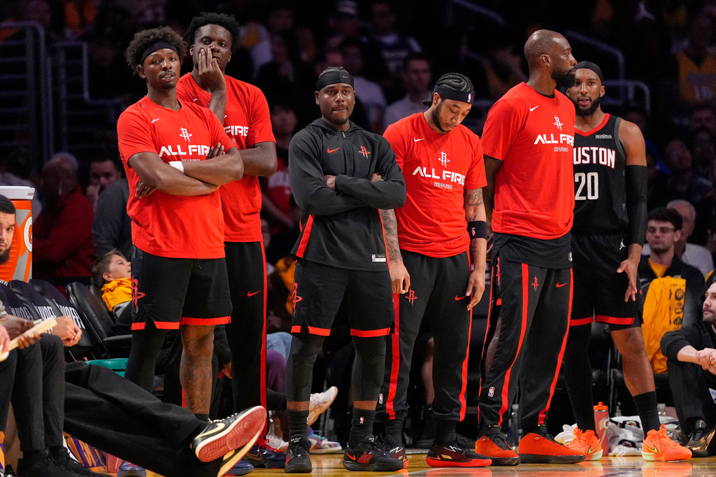 Members of the Houston Rockets bench watch in the closing seconds in Game 1 of a first-round NBA playoffs basketball series against the Los Angeles Lakers, Saturday, April 18, 2026, in Los Angeles. (AP Photo/Mark J. Terrill)
