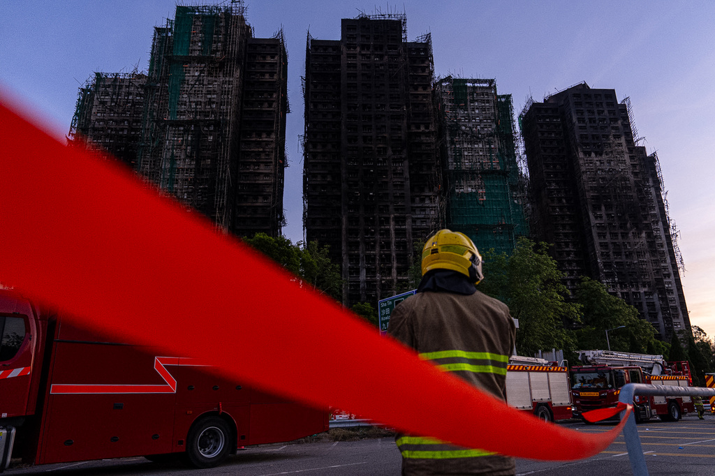 Burned buildings stand in the aftermath of a fire at Wang Fuk Court, a residential estate in the Tai Po district of Hong Kong's New Territories, Friday, Nov. 28, 2025. (AP Photo/Chan Long Hei)