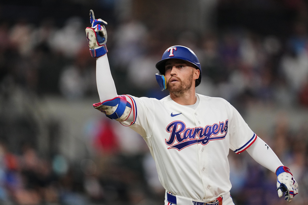 Texas Rangers' Brandon Nimmo celebrates his single in the second inning of a baseball game Tuesday, Sept. 22, 2026, in Arlington, Texas. (AP Photo/Tony Gutierrez)