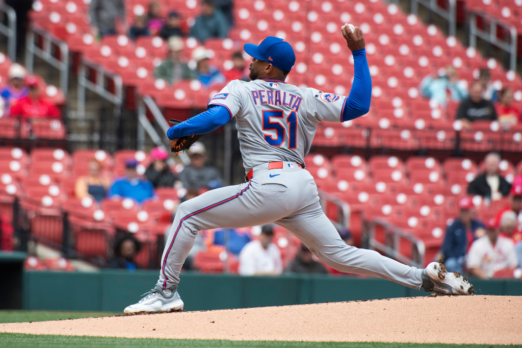New York Mets' pitcher Freddy Peralta throws during the first inning of a baseball game against the St. Louis Cardinals, Wednesday, April 1, 2026, in St. Louis. (AP Photo/LG Patterson)