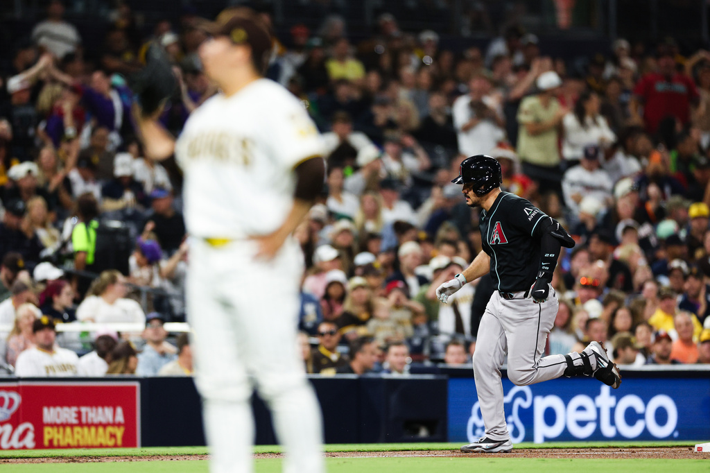 Arizona Diamondbacks' Nolan Arenado, right, runs the bases after hitting a solo home run off San Diego Padres' Yuki Matsui in the sixth inning of a baseball game Thursday, July 9, 2026, in San Diego. (AP Photo/Derrick Tuskan)