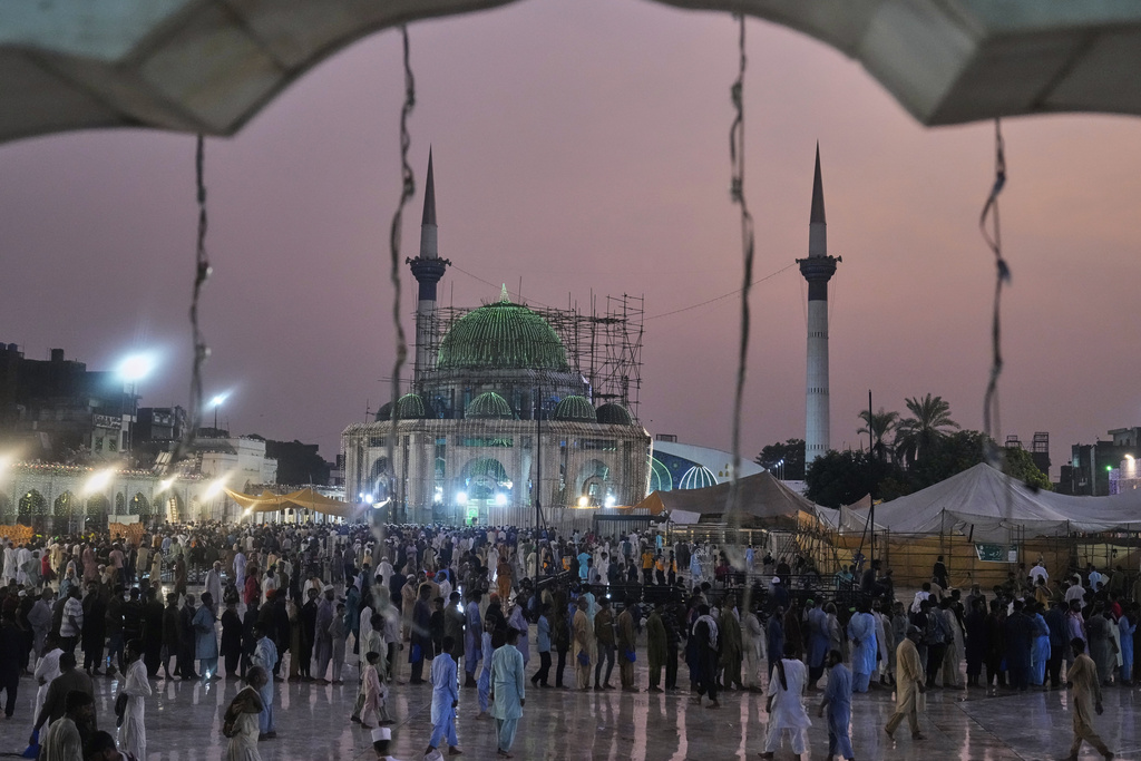 Devotees attend celebrations of the three-day annual festival or 'Urs' of mystic and scholar Hazrat Ali Hajveri, popularly known as Data Ganj Bakhsh at his shrine, in Lahore, Pakistan, Wednesday, Aug. 13, 2025. (AP Photo/K.M. Chaudary)