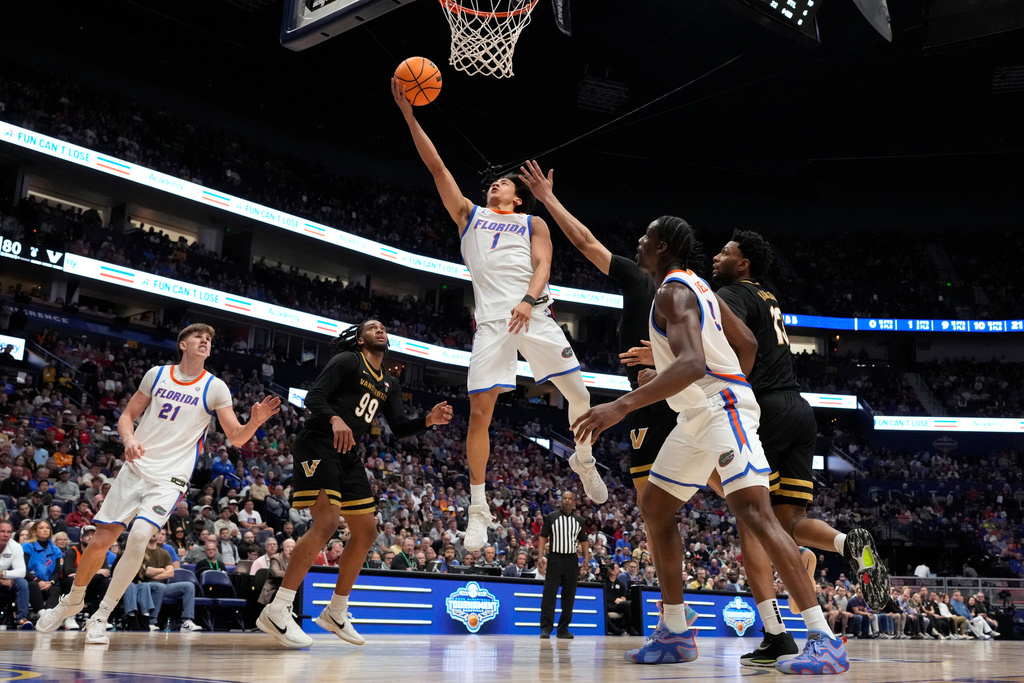 Florida guard Xaivian Lee (1) shoots a basket during the second half of an NCAA college basketball game against Vanderbilt in the semifinals of the Southeastern Conference tournament Saturday, March 14, 2026, in Nashville, Tenn. (AP Photo/George Walker IV)