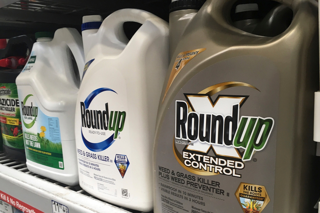 FILE - Containers of Roundup are displayed on a store shelf in San Francisco on Feb. 24, 2019. (AP Photo/Haven Daley, File)