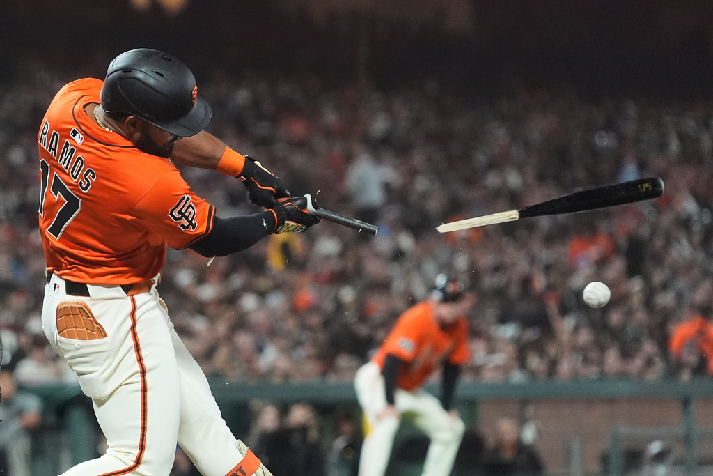 San Francisco Giants' Heliot Ramos breaks his bat while fouling off a pitch during the sixth inning of a baseball game against the Colorado Rockies in San Francisco, Friday, Sept. 26, 2025. (AP Photo/Jeff Chiu)