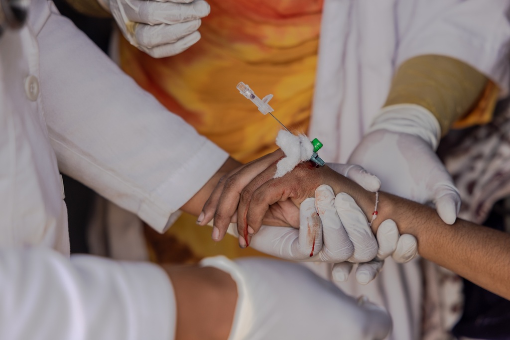 A young Malian woman is treated for her dangerously high fever and infection by doctors at the Douankaran health clinic in the Hodh El Chargui Region, Mauritania, Nov. 7, 2025. (AP Photo/Caitlin Kelly)