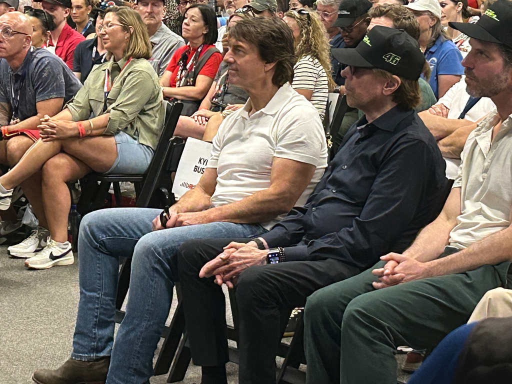 Actor Tom Cruise and movie producer Jerry Bruckheimer attend a drivers meeting before a NASCAR Cup Series auto race at Daytona International Speedway, Saturday, Aug. 29, 2026, in Daytona Beach, Fla. (AP Photo/Mark Long)