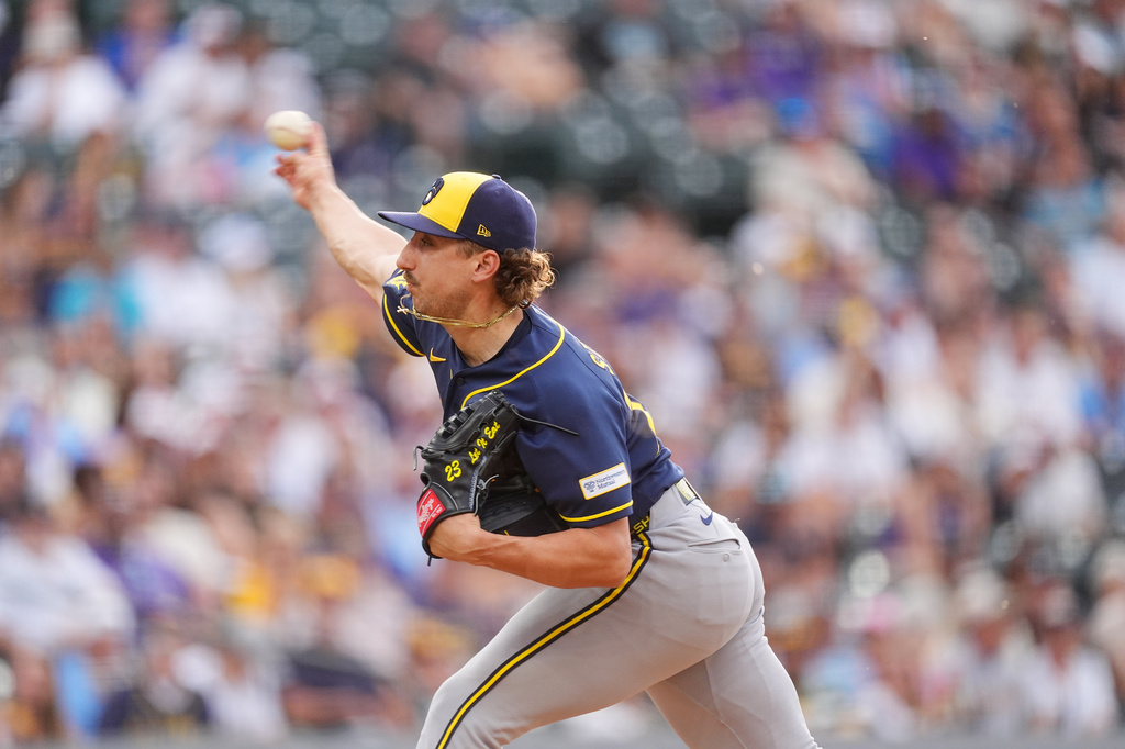Milwaukee Brewers starting pitcher Brandon Sproat works against the Colorado Rockies in the first inning of a baseball game Friday, June 5, 2026, in Denver. (AP Photo/David Zalubowski)