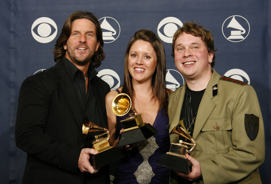 FILE - Brett James, from left, Hillary Lindsey and Gordie Sampson hold their award for best country song, "Jesus Take the Wheel," at the 49th Annual Grammy Awards in Los Angeles on Feb. 11, 2007. (AP Photo/Kevork Djansezian, File)