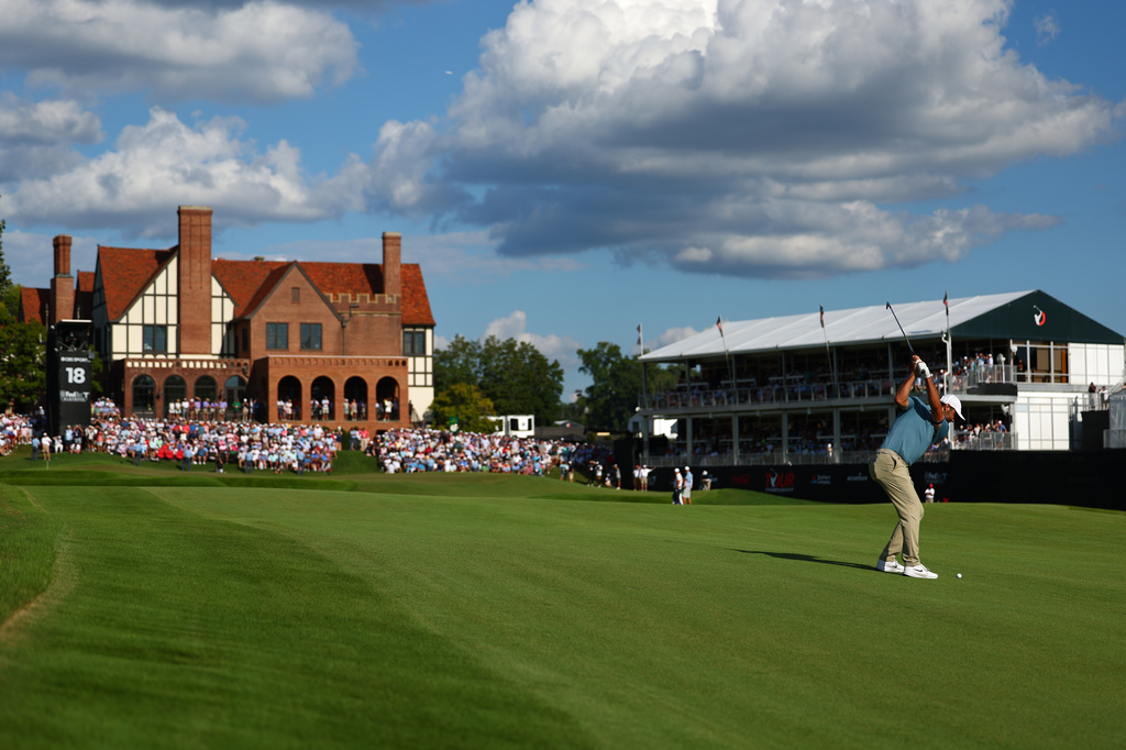 Scottie Scheffler hits from the fairway on the 18th hole during the final round of the PGA Tour Championship golf tournament Sunday, Aug. 30, 2026, in Atlanta. (AP Photo/Colin Hubbard)