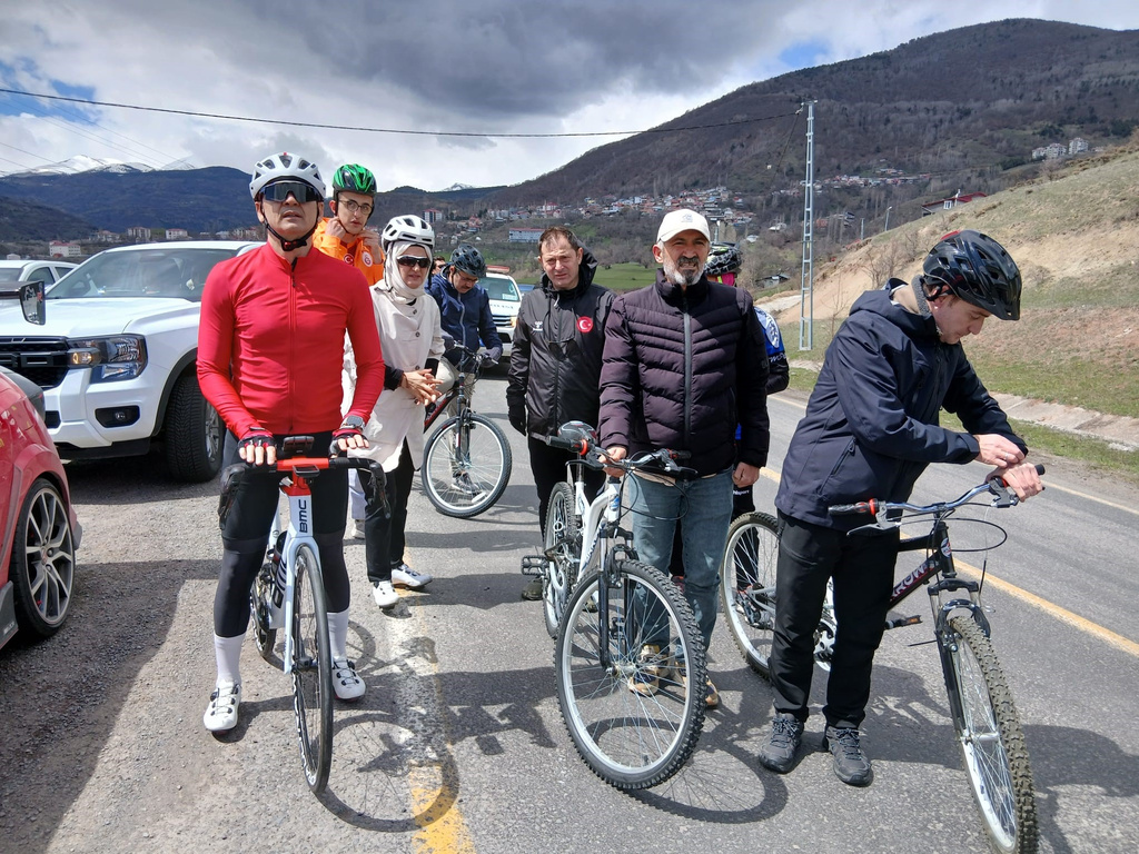 Governor of Ardahan province Mehmet Fatih Cicekli, left, takes part in a popular cycle tour to promote tourism, in Ardahan, eastern Turkey, Sunday, April 26, 2026. (Halil Ibrahim Ataman/IHA via AP)