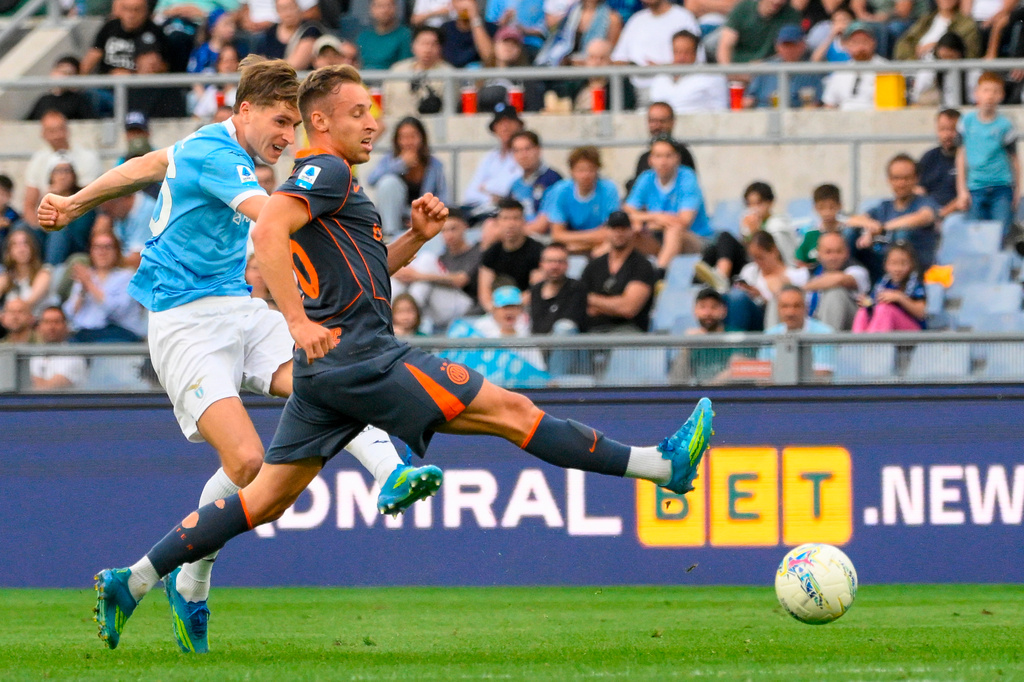 Lazio's Toma Basic, left, and Inter Milan's Davide Frattesi vie for the ball during a Serie A soccer match between Lazio and Inter Milan, in Rome, Saturday, May 9, 2026. (Fabrizio Corradetti/LaPresse via AP)