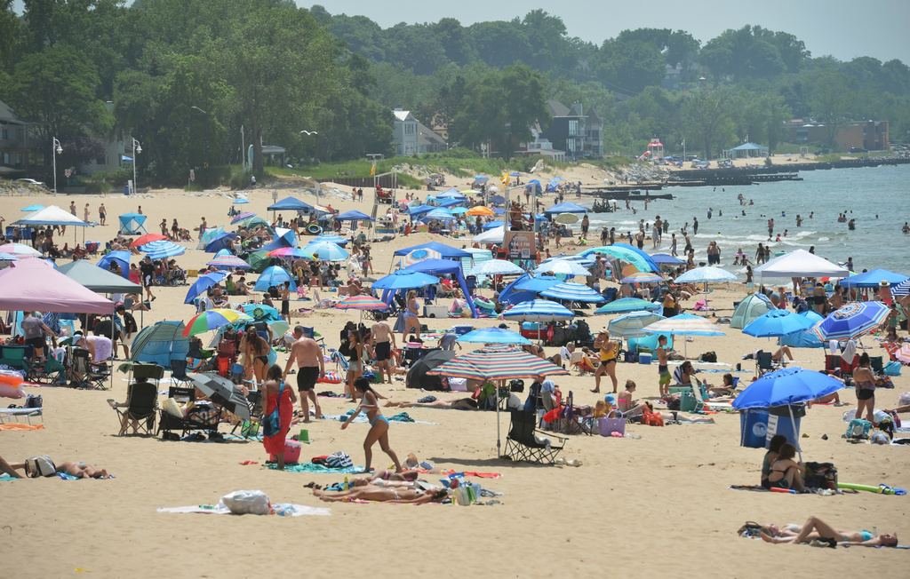 Beachgoers pack Silver Beach along Lake Michigan Tuesday, June 30, 2026, in St. Joseph, Mich. (Don Campbell/The Herald-Palladium via AP)