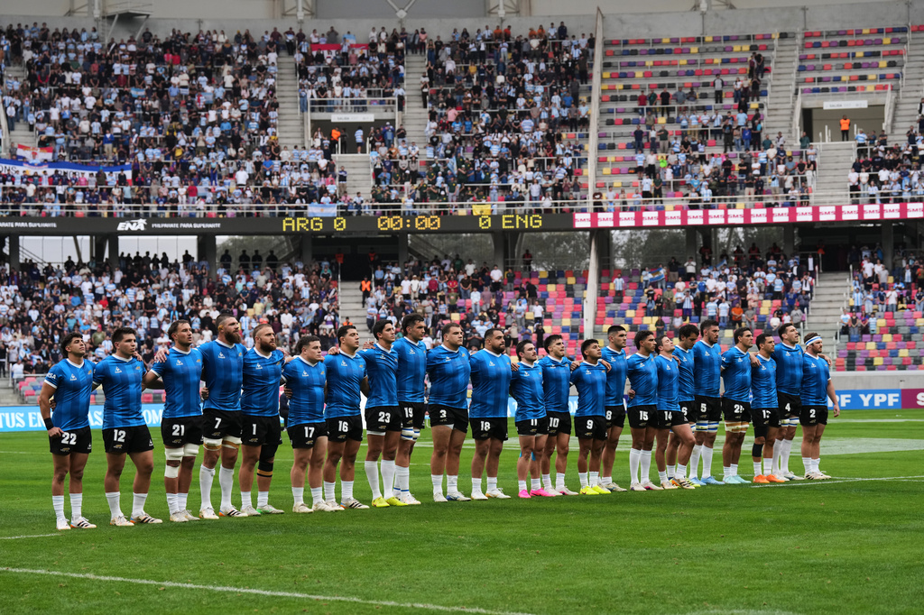 Argentina players sing the national anthem while wearing a commemorative jersey inspired by the one worn by Argentina during its 1986 World Cup quarterfinal victory over England, before a Nations Championship rugby match between Argentina and England in Santiago del Estero, Argentina, Saturday, July 18, 2026. (AP Photo/Gustavo Garello)