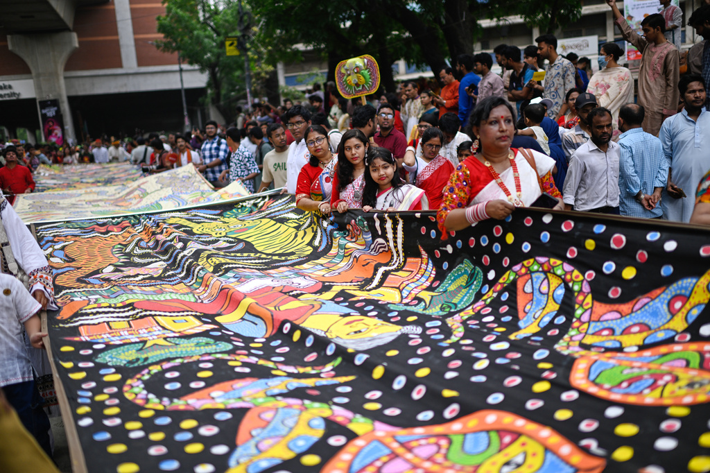 People participate at the Baishakhi Shobhajatra procession to celebrate the first day of the Bangla New Year in Dhaka, Bangladesh, Tuesday, April 14, 2026. (AP Photo/Mahmud Hossain Opu)