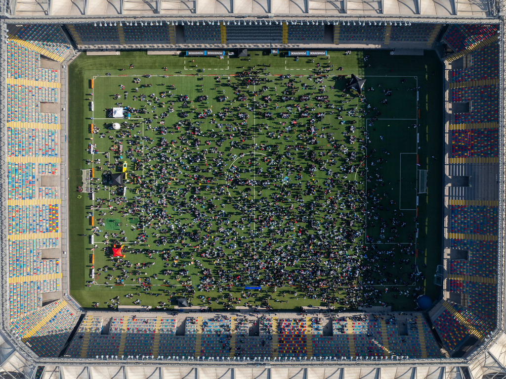 Soccer fans gather to trade Panini World Cup sticker albums and trading cards at the Bicentenario de La Florida stadium in Santiago, Chile, Sunday, May 31, 2026. (AP Photo/Esteban Felix)