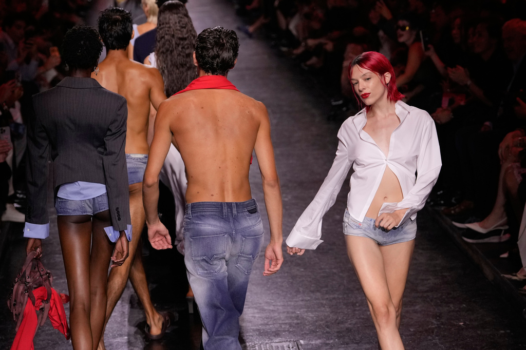Models wear creations part of the Diesel women's Spring-Summer 2027 collection presented in Milan, Italy, Tuesday, Sept. 22, 2026. (AP Photo/Luca Bruno).