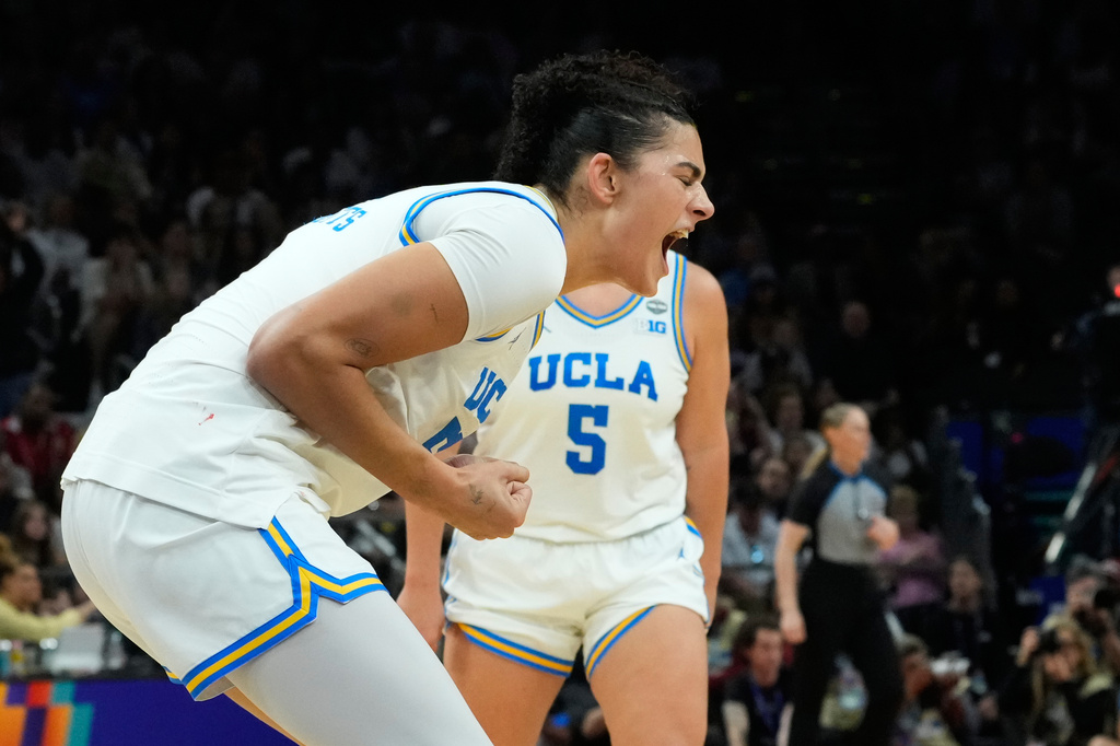 UCLA center Lauren Betts (51) celebrates after a play against South Carolina during the second half of the women's National Championship Final Four NCAA college basketball tournament game, Sunday, April 5, 2026, in Phoenix. (AP Photo/Ross D. Franklin)