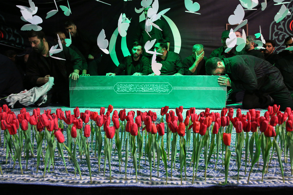 In this photo released by Iran's Supreme Leader's office, mourners gather around the coffin of Iran's Supreme Leader Ayatollah Ali Khamenei as it lies in a mourning hall adjacent to the Imam Khomeini Hussainiya within the Supreme Leader's compound before his funeral in Tehran, Iran, late Thursday, July 2, 2026. (Office of the Iranian Supreme Leader via AP)