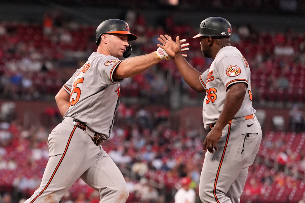 Baltimore Orioles' Pete Alonso, left, is congratulated by first base coach Jason Bourgeois after hitting a three-run home run during the third inning of a baseball game against the St. Louis Cardinals Tuesday, Aug. 25, 2026, in St. Louis. (AP Photo/Jeff Roberson)