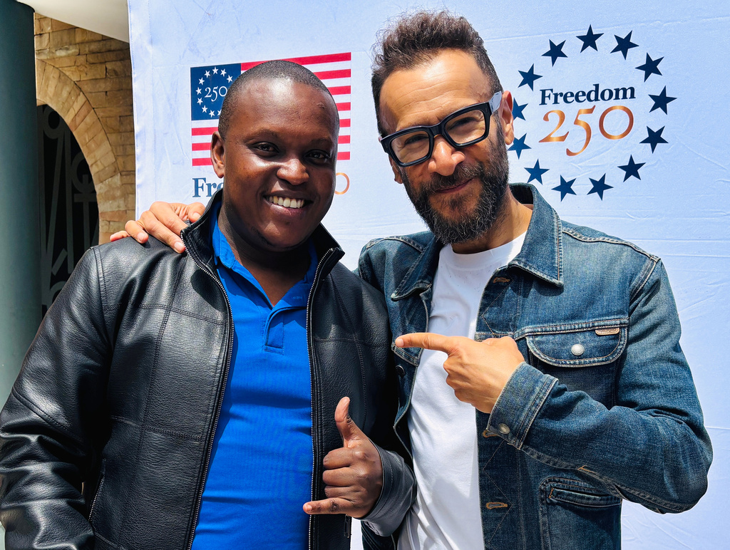 In this photo taken with a smartphone, The Recording Academy President Panos A. Panay, right, poses with Kenyan content creator Andrew 'Dru' Thiga on Friday, Sept. 11, 2026, in Nairobi, Kenya. (AP Photo/Jackson Njehia)