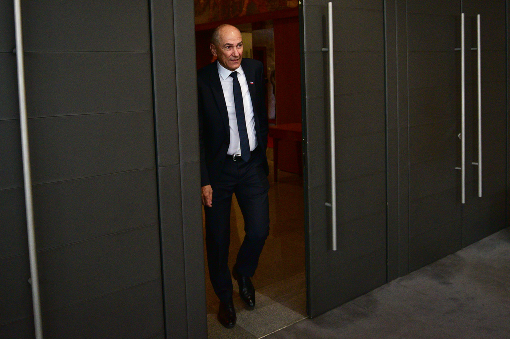 Janez Jansa arrives for a session of the Slovenian Parliament in Ljubljana, Slovenia, Friday, May 22, 2026, before appointing him as prime minister, ending a political deadlock after tight elections in March. (AP Photo/Igor Kupljenik)