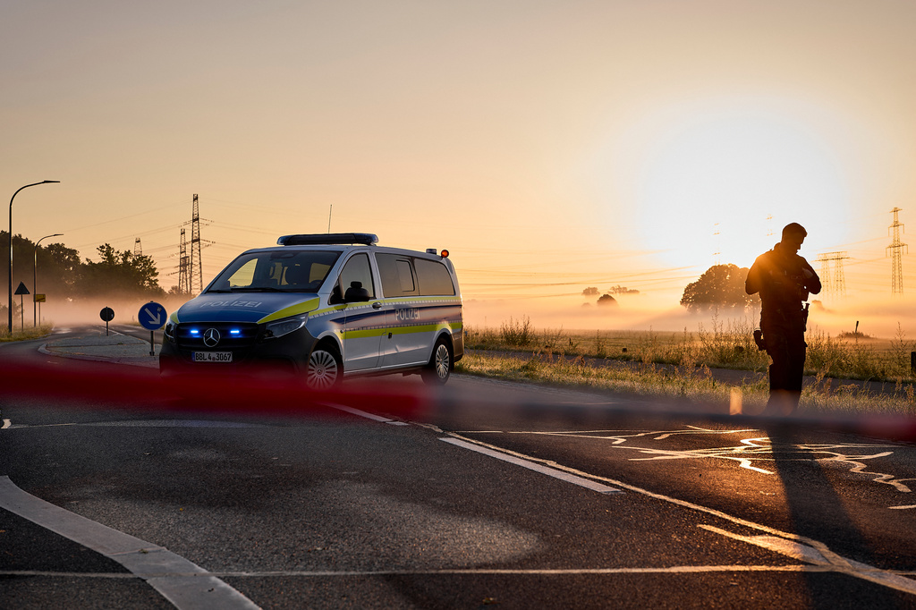 A police vehicle is blocking a road leading to the Jänschwalde power plant in Turnow-Preilack, Germany, Wednesday, Sept. 2, 2026. (Michael Ukas/dpa via AP)