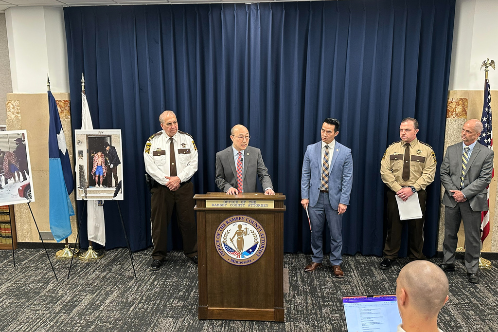 From left, Ramsey County Sheriff Bob Fletcher, Ramsey County Attorney John Choi and Ramsey County Attorney's Office Trial Division Director Hao Nguyen make an announcement on Monday, April 13, 2026 in St. Paul, Minn., about investigations into possible crimes committed by federal agents during the Trump administration's immigration enforcement surge. (AP Photo/Mark Vancleave)