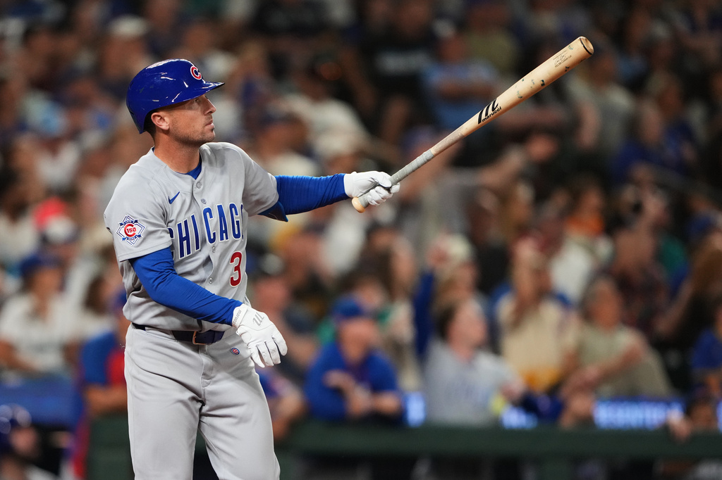 Chicago Cubs' Alex Bregman follows through on a solo home run against the Seattle Mariners during the ninth inning of a baseball game, Friday, Aug. 21, 2026, in Seattle. (AP Photo/Lindsey Wasson)